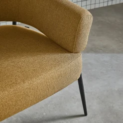 Fauteuil stof gebogen rugleuning metalen frame