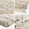 Interieur vloerkleed met gevlekt patroon crème