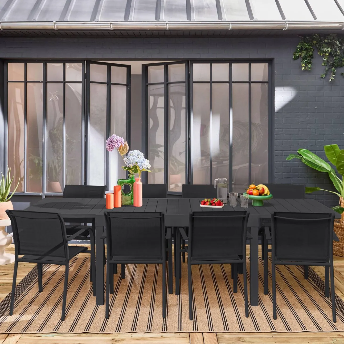 Verlengbare tuintafel met 8 stoelen van aluminium en textileen