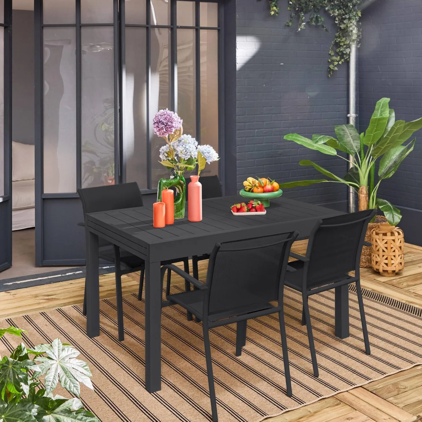 Verlengbare tuintafel met 8 stoelen van aluminium en textileen