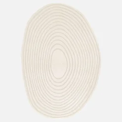 Vloerkleed in de vorm van een kiezelsteen met crèmekleurig cirkelpatroon voor binnen